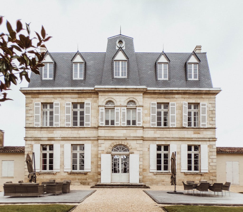 Charming facade of a classic French manor in Bordeaux, showcasing unique architecture.